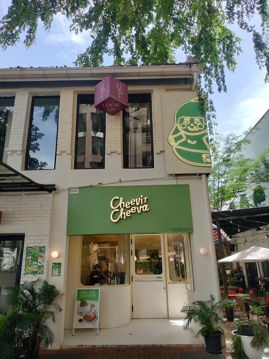 Cheevit Cheeva shopfront with the green mascot